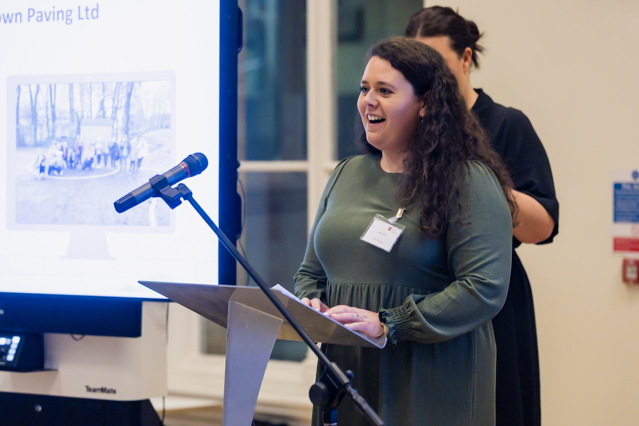 A planning consultant from STAT Planning speaking at an industry event, highlighting professional expertise and leadership in planning consultancy.